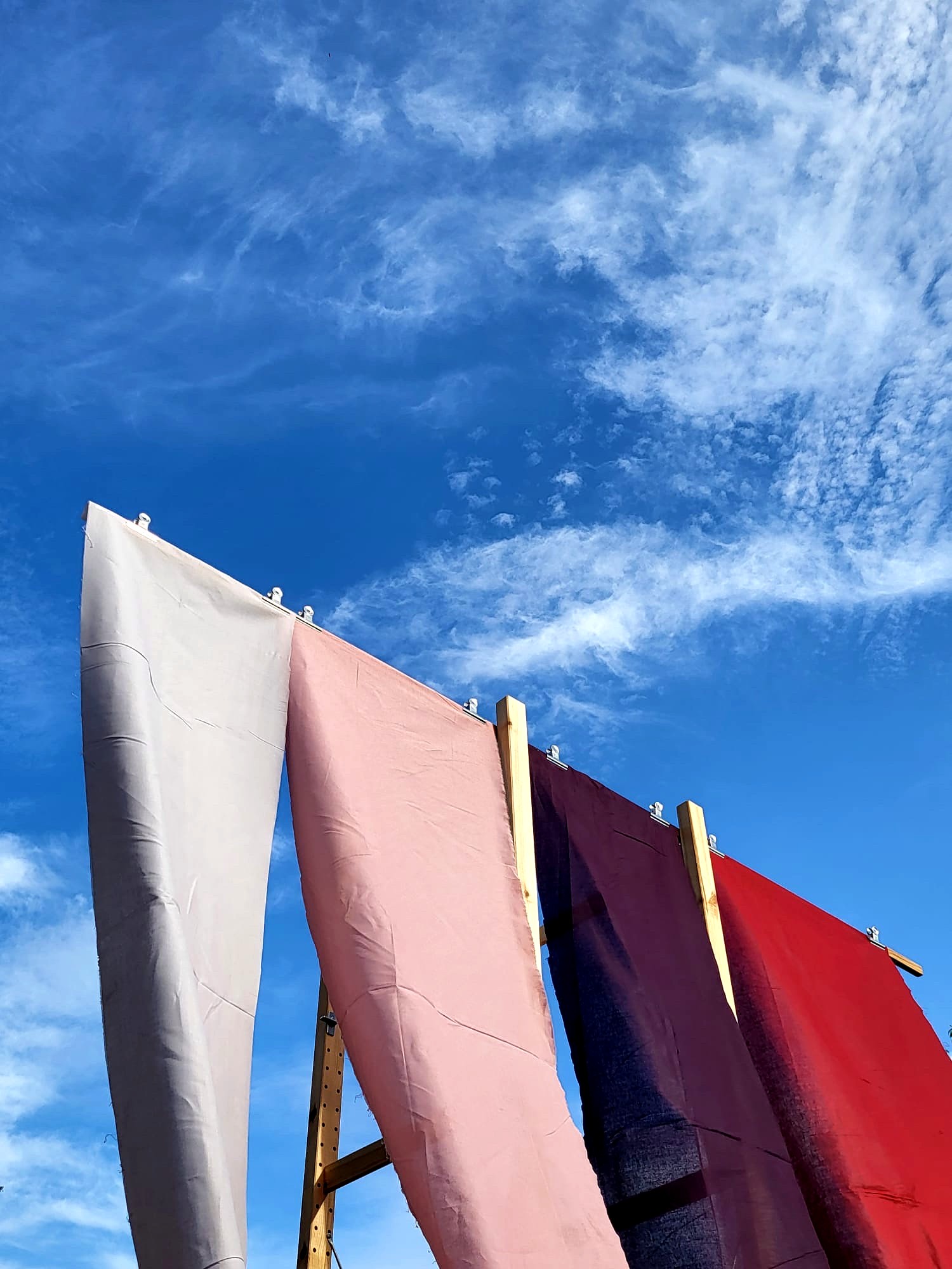 VIENNA DESIGN WEEK x EUROPEAN FORUM ALPBACH, dyed fabrics drying against the sky